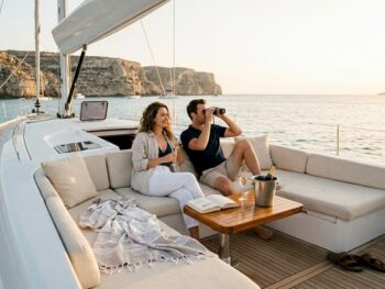 Couple relaxing on yacht at Malta sunset